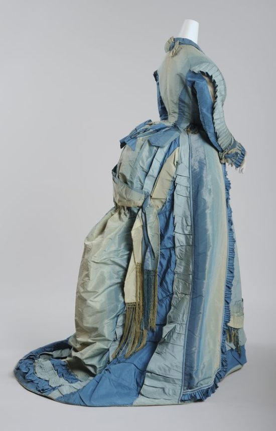 Elaborate 1870s gown with peplum